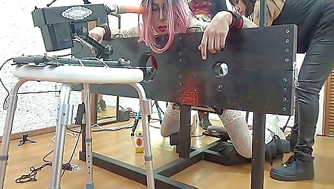 Busty brunette in a sexy outfit gets fucked by a dildo