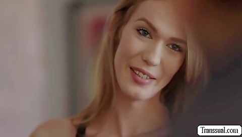 Petite redhead in red dress is sucking his big dong