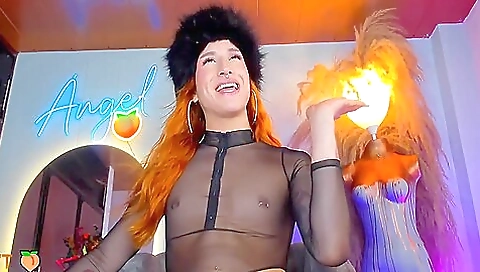 Gorgeous red-haired babe is naked and showing off her body